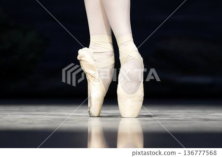 Close-up of ballet dancers legs in pointe shoes  136777568