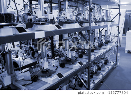 Many 3D printers printing object. 3D printers printing model from molten plastic. 3D printers creating shape from molten plastic flowing out of extruder. New modern 3D Printing additive technologies 136777804