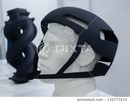 Protective helmet. Helmet printed on 3D printer from powder material. Model printed on 3D printer from melted polyamide powder. Multi Jet Fusion. Modern additive progressive 3D printing technology 136777814