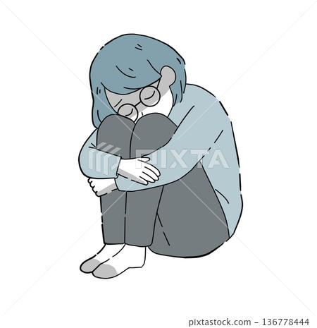 一位戴著眼鏡的黑人女子坐在地板上。 一位戴著眼鏡的黑人女子坐在地板上。 136778444