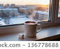 Warm cup of hot chocolate with marshmallow by a winter window view 136778688