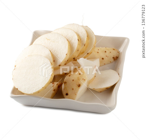 Yamaimo roots and slices or Chinese yam isolated over white background 136779123