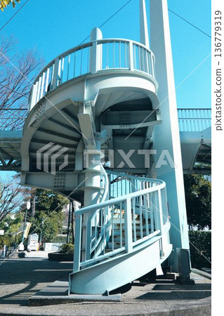 Spiral staircase and blue sky Spiral staircase and blue sky 136779319