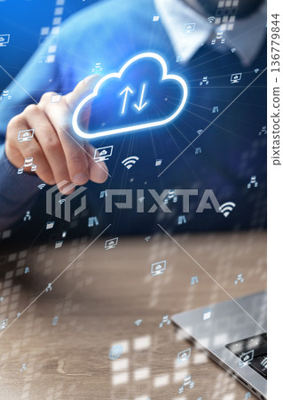 Cloud technology usage for data transfer during work on a laptop in an office setting 136779844