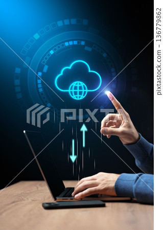 Person using laptop to upload data to cloud storage in digital workspace Person using laptop to upload data to cloud storage in digital workspace 136779862