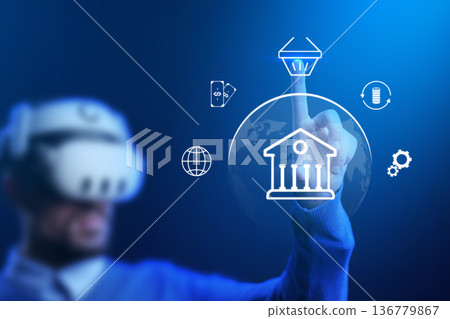 Man using virtual reality to make a banking invoice payment in a digital space 136779867