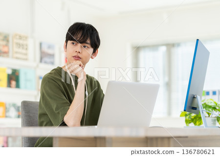 A young engineer man working in the office A young engineer man working in the office 136780621