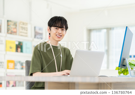 A young engineer man working in the office A young engineer man working in the office 136780764