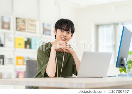 A young engineer man working in the office A young engineer man working in the office 136780767