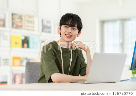 A young engineer man working in the office 136780770