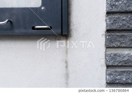 A residential gate with rain marks that needs exterior painting 136780864