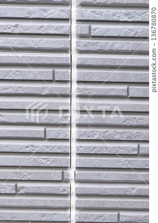 Exterior walls of houses that require repainting and caulking replacement Exterior walls of houses that require repainting and caulking replacement 136780870