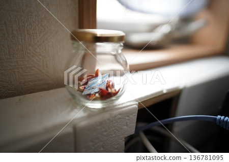 Small bottle of chili peppers Small bottle of chili peppers 136781095
