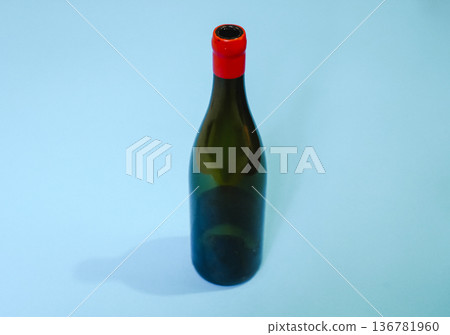 Empty Wine Bottle on a Minimalist Pastel Blue Background Empty Wine Bottle on a Minimalist Pastel Blue Background 136781960
