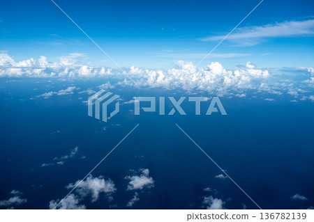 Aerial view of fluffy clouds over the Pacific Ocean in Polynesia 136782139