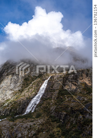 Waterfall cascading from snowy mountains on the Laguna 69 trek, Peru 136782154