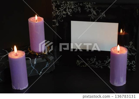 funeral, a photo frame, candles, marble urn for ashes, spiritual bracelet with black cross 136783131