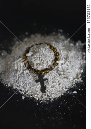 a spiritual bracelet with a cross in ashes, funeral 136783181