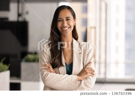 Pretty New Zealander woman posing in modern office 136783396