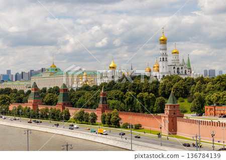 Historic Kremlin and beautiful skyline in Moscow on a bright, sunny day with fluffy clouds Historic Kremlin and beautiful skyline in Moscow on a bright, sunny day with fluffy clouds 136784139