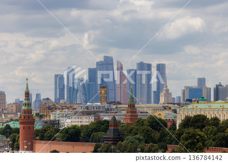 Skyline view of Moscow with modern skyscrapers and historic buildings under a cloudy sky Skyline view of Moscow with modern skyscrapers and historic buildings under a cloudy sky 136784142