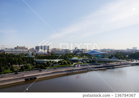 View of a vibrant urban park along the riverbank in Moscow on a sunny day 136784367