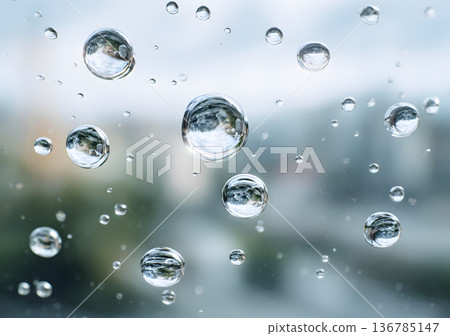 Water droplets attached to the glass 136785147