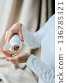 Pills and health supplements. Woman is taking supplements 136785321
