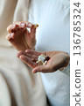 Pills and health supplements. Woman is taking supplements 136785324