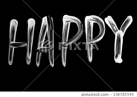 Expressive white brush word HAPPY handwritten on dark background 136785545