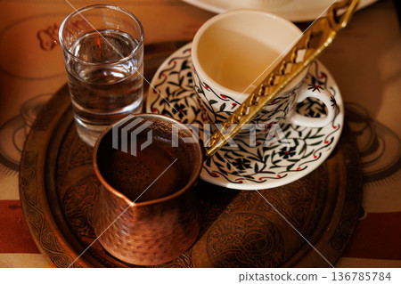 Delightful coffee experience with traditional Turkish preparation in an inviting cafe setting Delightful coffee experience with traditional Turkish preparation in an inviting cafe setting 136785784