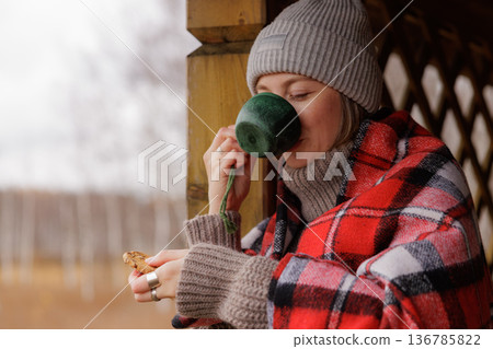 Enjoying warm moments with tea in cozy surroundings on a chilly autumn day 136785822