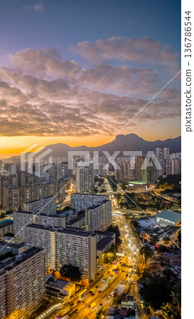 Golden sunset illuminating Choi Hung skyline and mountains Feb 5 2026 136786544