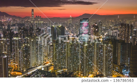 Warm sunset glow lights Kai Tak urban skyline Feb 5 2026 Warm sunset glow lights Kai Tak urban skyline Feb 5 2026 136786563