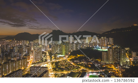 Dusk light illuminates Wong Tai Sin urban skyline beautifully Feb 5 2026 136786592