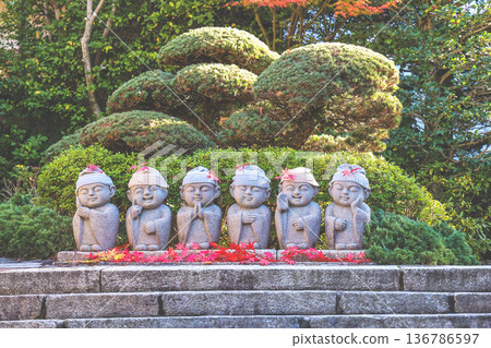 Stone Buddha Statues In Garden With Knit Hats at kyoto Stone Buddha Statues In Garden With Knit Hats at kyoto 136786597