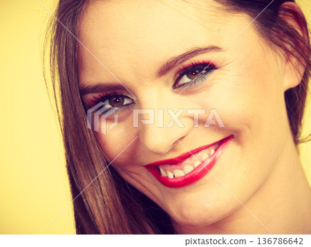 Smiling attractive woman with full makeup Smiling attractive woman with full makeup 136786642