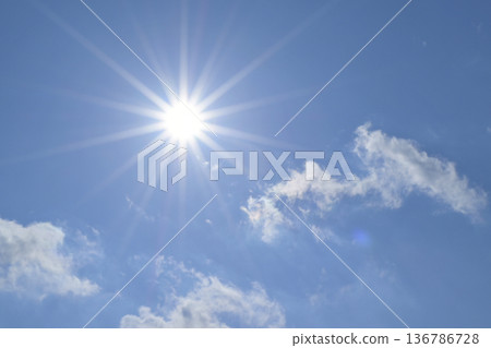 Blue sky and sun, direct sunlight, free space image (Fix photo) 136786728