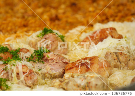 Many pork knuckle in big pot. 136786776