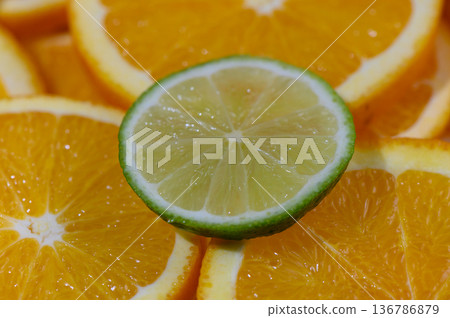 Lime Wedge on Orange Slices Lime Wedge on Orange Slices 136786879