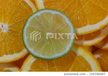 Single Lime Slice on Orange Wedges 136786887