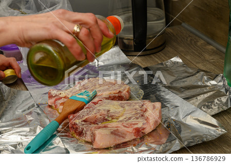 Preparing Herb and Garlic Marinade for Lamb Chops on Foil Preparing Herb and Garlic Marinade for Lamb Chops on Foil 136786929