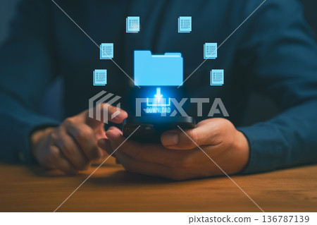 Digital file download concept showing person using smartphone with glowing folder icon and data transfer graphics, representing cloud storage, online document sharing, and mobile technology. Digital file download concept showing person using smartphone with glowing folder icon and data transfer graphics, representing cloud storage, online document sharing, and mobile technology. 136787139