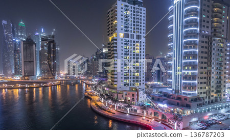 Water canal on Dubai Marina skyline at night timelapse. Water canal on Dubai Marina skyline at night timelapse. 136787203