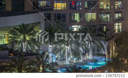 Rooftop swimming pool in Dubai marina night timelapse Rooftop swimming pool in Dubai marina night timelapse 136787212