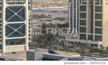 Aerial view of Jumeirah lakes towers skyscrapers timelapse with traffic on sheikh zayed road. Aerial view of Jumeirah lakes towers skyscrapers timelapse with traffic on sheikh zayed road. 136787228