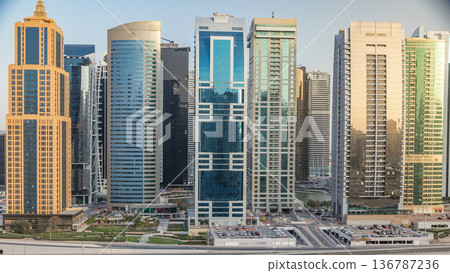 Aerial view of Jumeirah lakes towers skyscrapers timelapse with traffic on sheikh zayed road. Aerial view of Jumeirah lakes towers skyscrapers timelapse with traffic on sheikh zayed road. 136787236