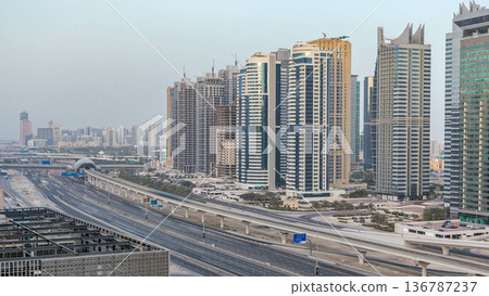 Amazing rooftop view on Sheikh Zayed road surrounded Dubai Marina and JLT skyscrapers Amazing rooftop view on Sheikh Zayed road surrounded Dubai Marina and JLT skyscrapers 136787237