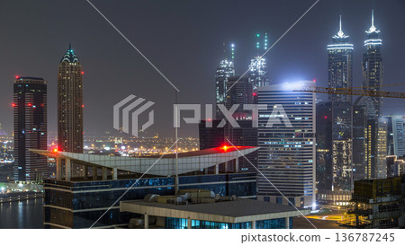 Dubai business bay towers night timelapse aerial Dubai business bay towers night timelapse aerial 136787245