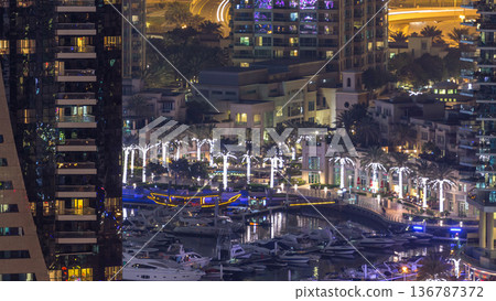 Water canal on Dubai Marina skyline at night timelapse. 136787372